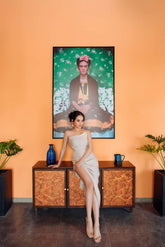 Bias-cut silk dress with ruched detail and thigh-high slit for elegant beach styling